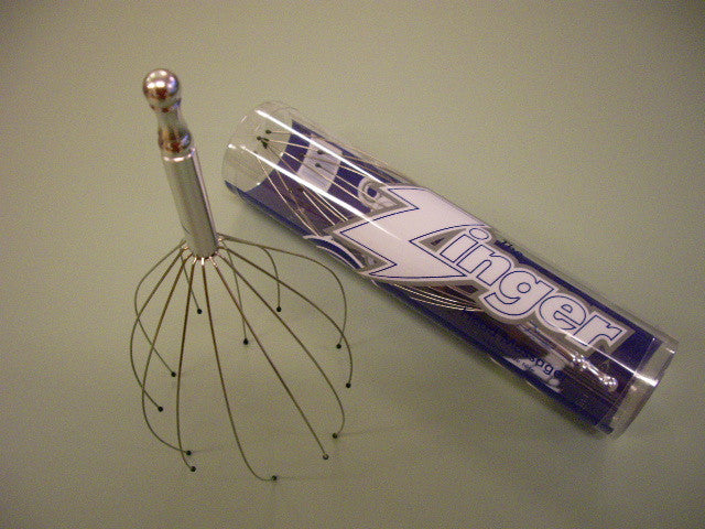 zingr head masager with soft resin-tipped stainless steel to stimulate nerve endings.